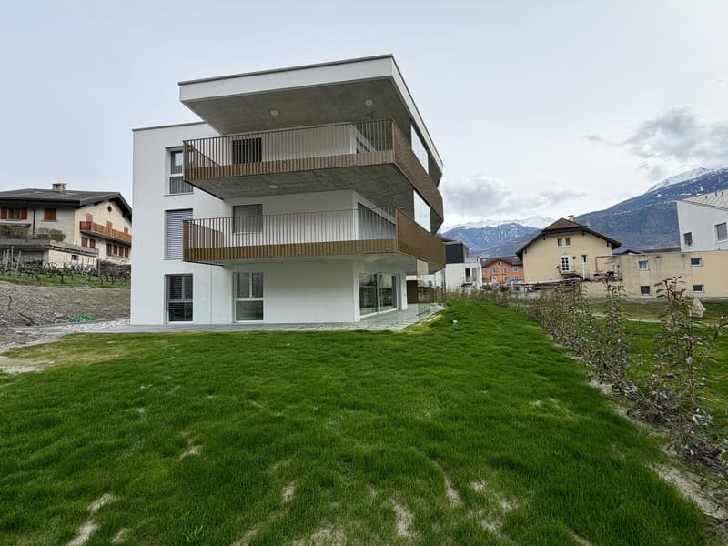 Modern white house, 3 floors, balconies, glass walls, surrounded by grass