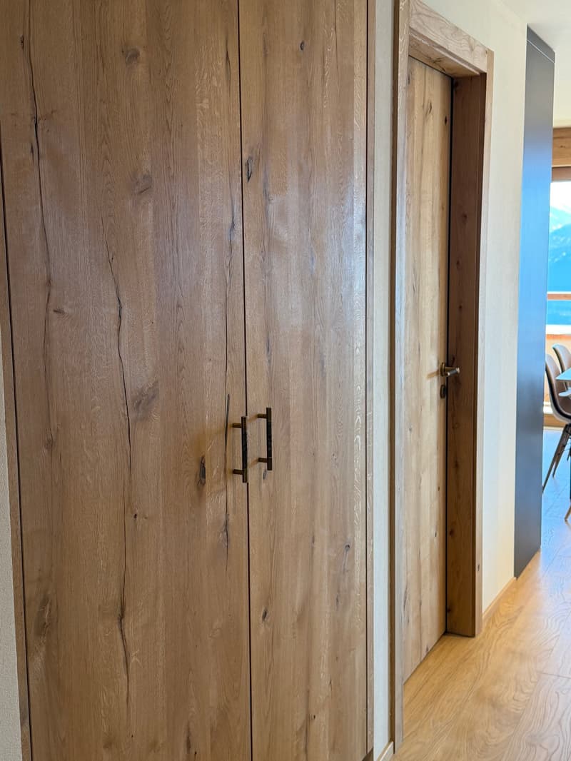 wooden closet, wooden door, wooden floor, view of mountains