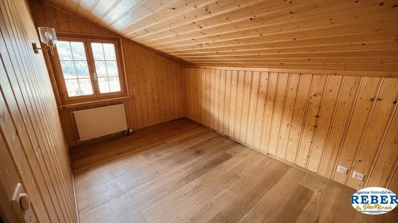 empty room, wooden walls, wooden floor, window, radiator, wall lamp