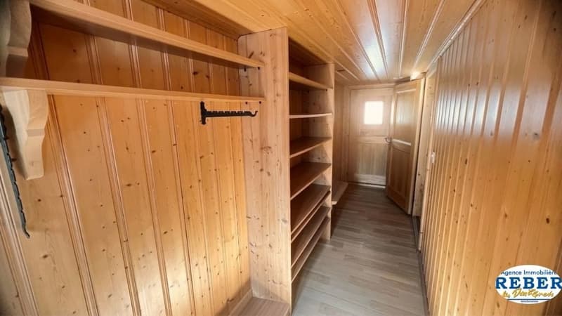 wooden walls, wooden shelves, wooden floor, coat rack