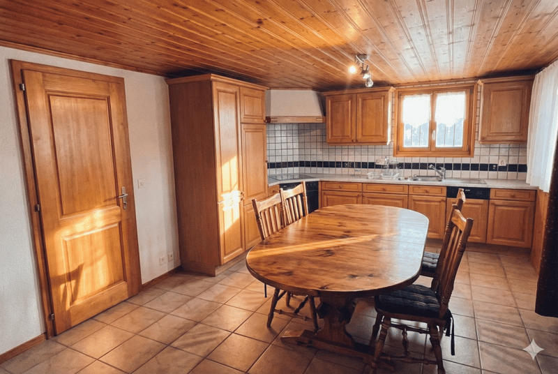 wooden ceiling, wooden floor, wooden table, wooden chairs, wooden cabinets, sink, faucet, window