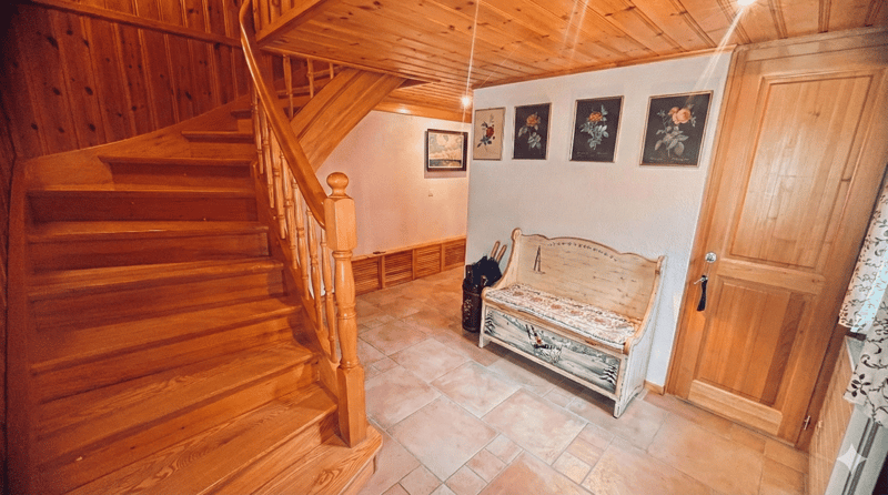 wooden stairs, wooden bench, tiled floor, wooden door, wall paintings