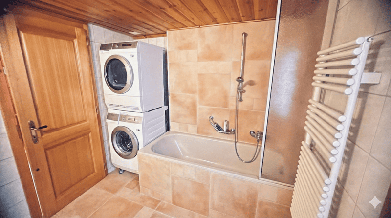 Bathroom with bathtub, shower, washing machine, and dishwasher