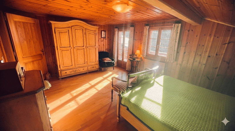 wooden walls, wooden floor, bed, chair, cabinet, lamp, windows, curtains