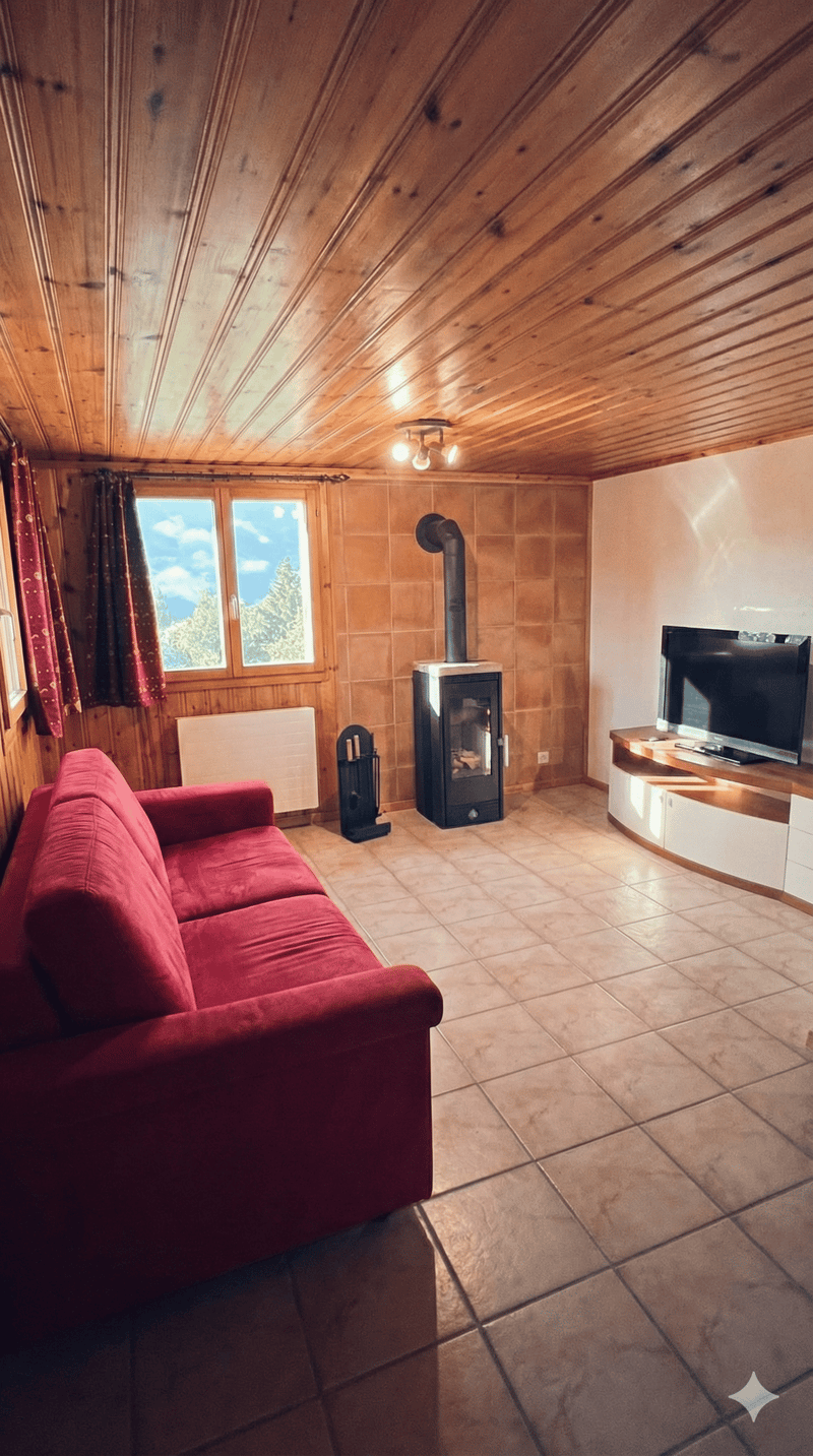 living room with fireplace, red couch, TV, tiled floor, wooden ceiling