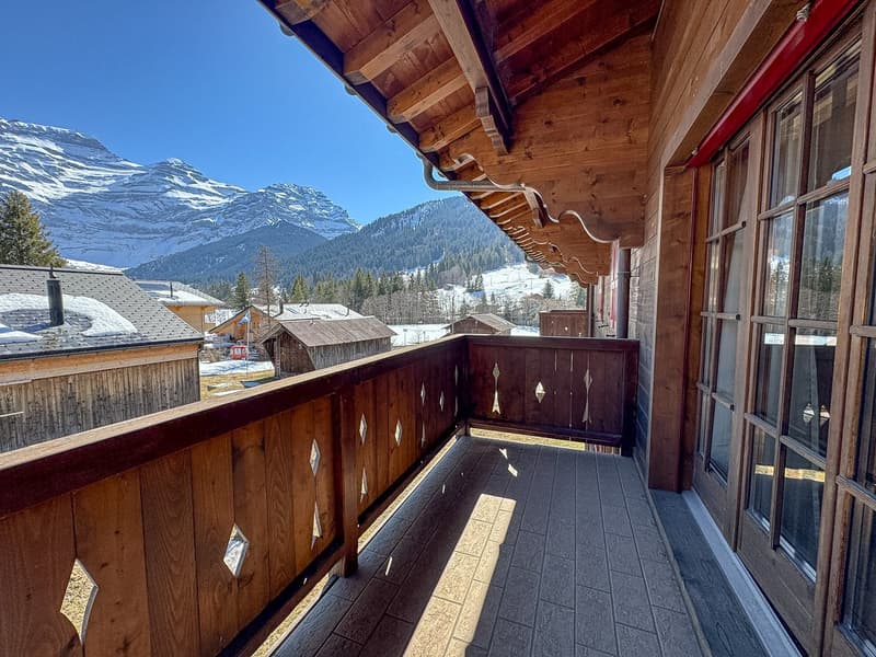 wooden balcony, wooden railing, tiled floor, glass door, mountain view
