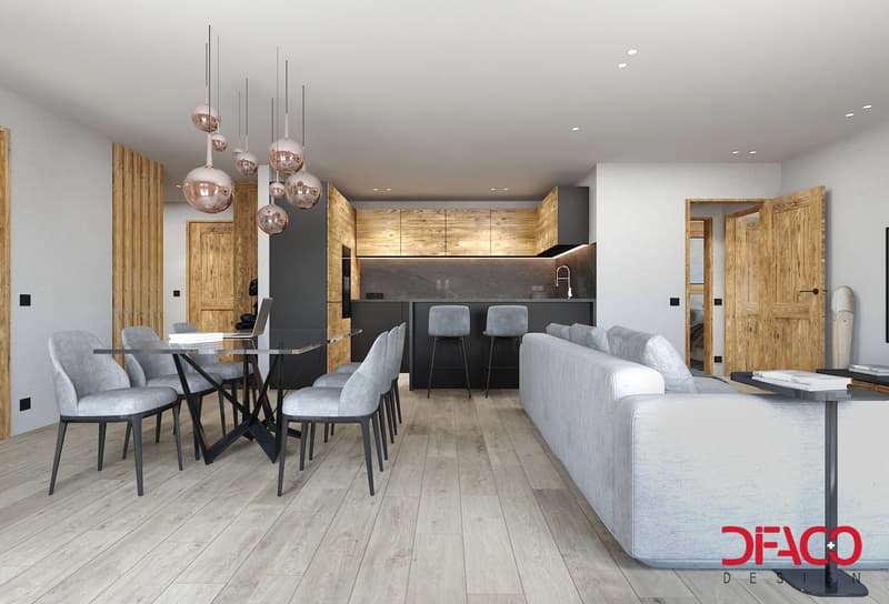 Dining room with a modern design featuring a table, modern chairs, gray sofa, wooden door, pendant lights, wooden cabinets, kitchen area with a sink and faucet, wooden floors, white walls