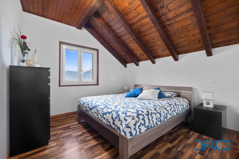 wooden floor, wooden ceiling, bed, lamps, nightstands, cupboard, window, flowers
