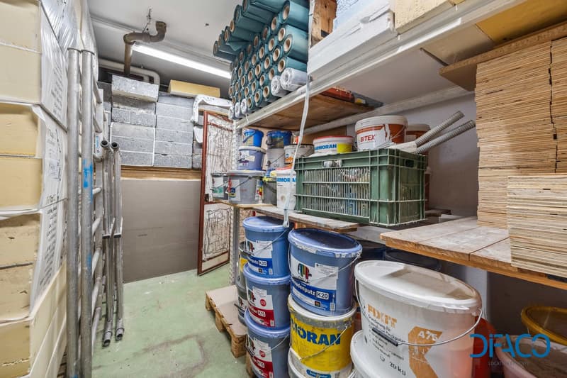 Storage room with shelves, buckets, and various materials