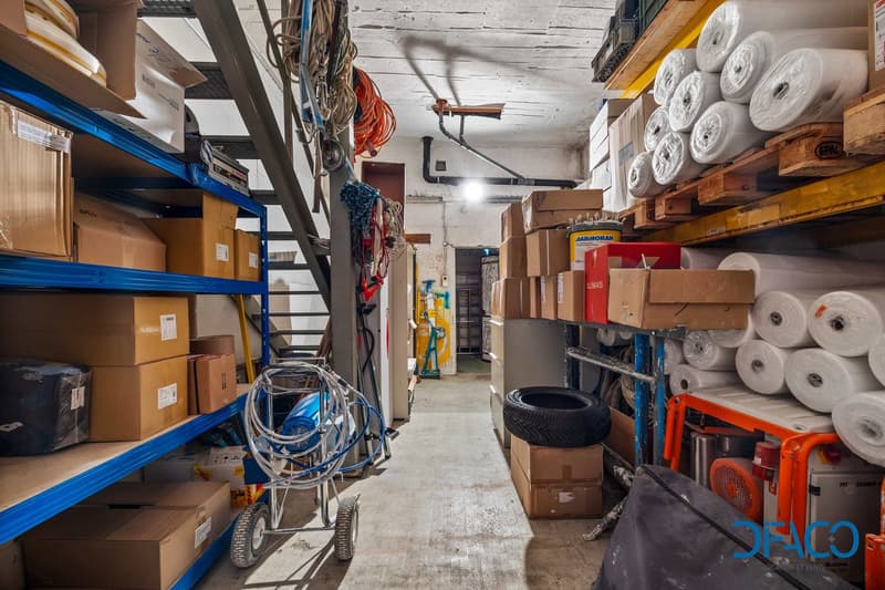 Storage room with shelves, boxes, tools, and equipment