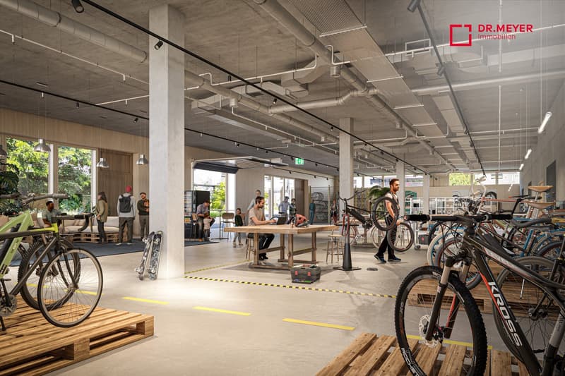 Industrial building with bicycle shop, large windows, tables, bicycles on display, shelves, high ceiling with pipes, wooden pallets