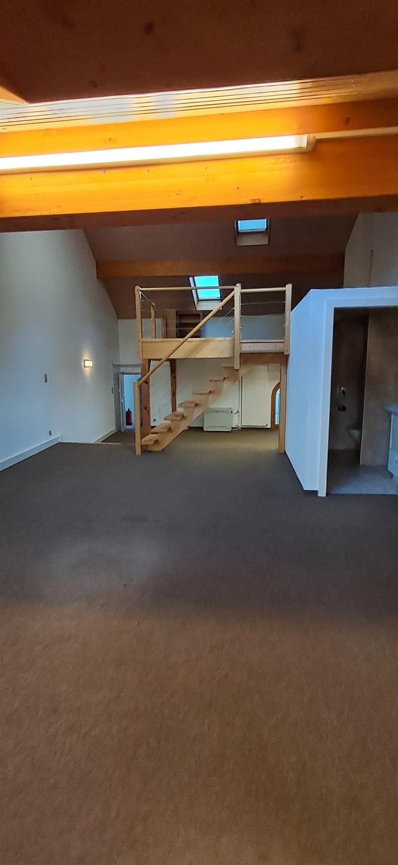 Empty room with a balcony and stairs