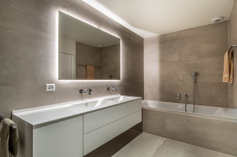 modern, gray tiles, white vanity, double sink, mirror, bathtub, shower, towel racks