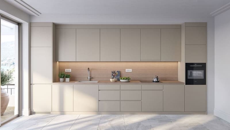 Spacious modern kitchen with light-colored cabinets, wooden countertop, built-in appliances including a dishwasher, and large windows providing natural light.