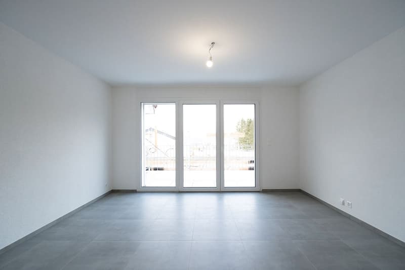 empty room, sliding glass doors, gray tiles, white walls, no furniture