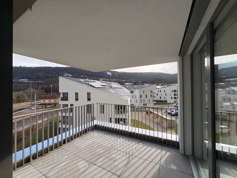 tiled balcony with railing, panoramic view of the landscape, solar panels on the building