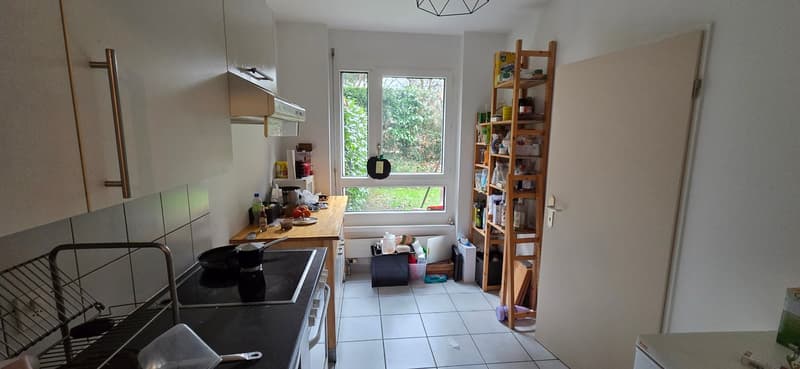 modern kitchen with white tile, gas stove, cabinet, refrigerator, wooden shelf, window, counter, kitchen tools