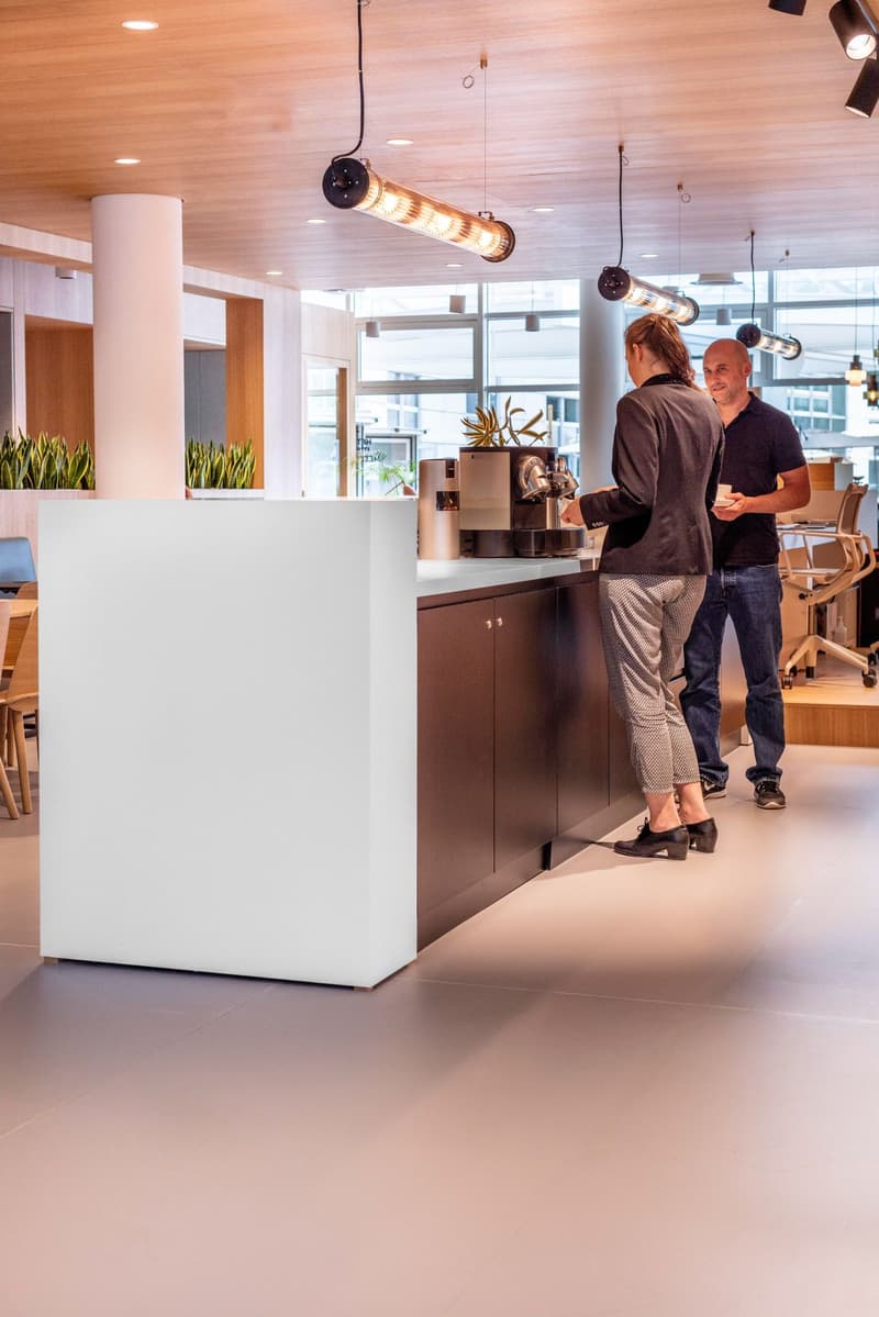modern open space, large white countertop, coffee machine, glass walls, modern furniture