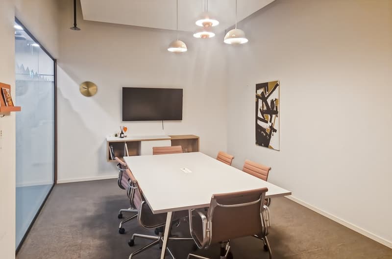 modern room, white walls, large desk, TV, cabinets, shelves