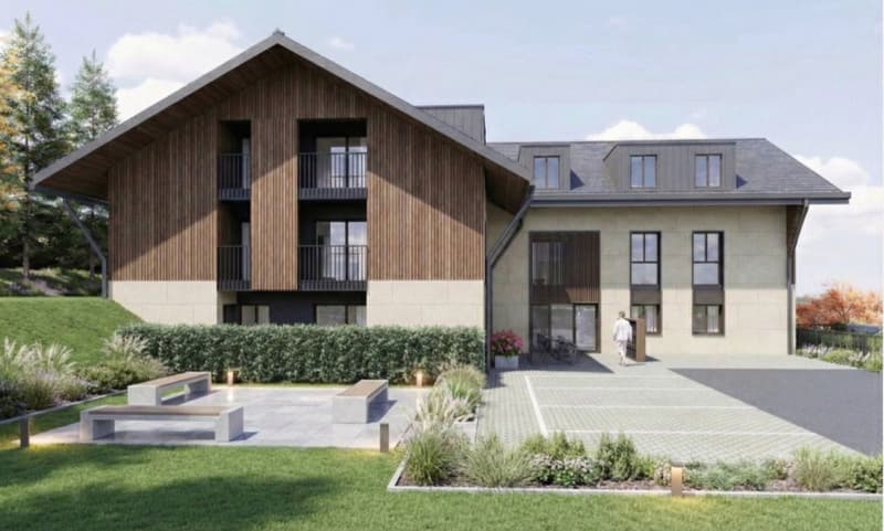 Multi-family house, wooden exterior, balcony, well-kept garden, bicycles parked