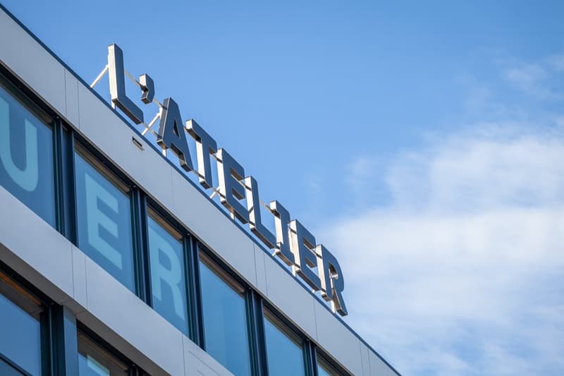 A modern multi-story building with large windows and the name 'LUFTHANSA' prominently displayed on the facade.