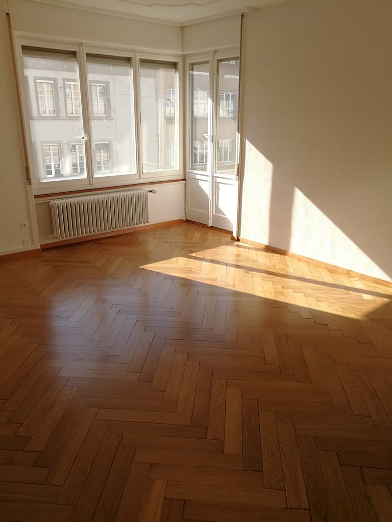 hardwood floor, large windows, sunlight, central heating