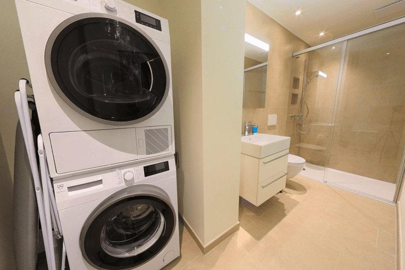 white appliances, mirror, toilet, shower, sink