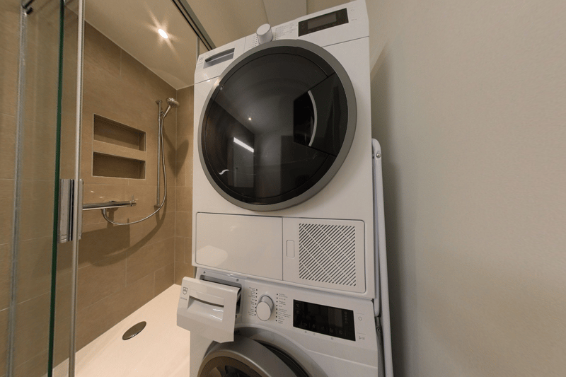 Washer and dryer combo unit, shelving, tiled floor
