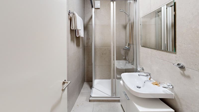 white tiles, separate shower, sink, mirror, white cabinets