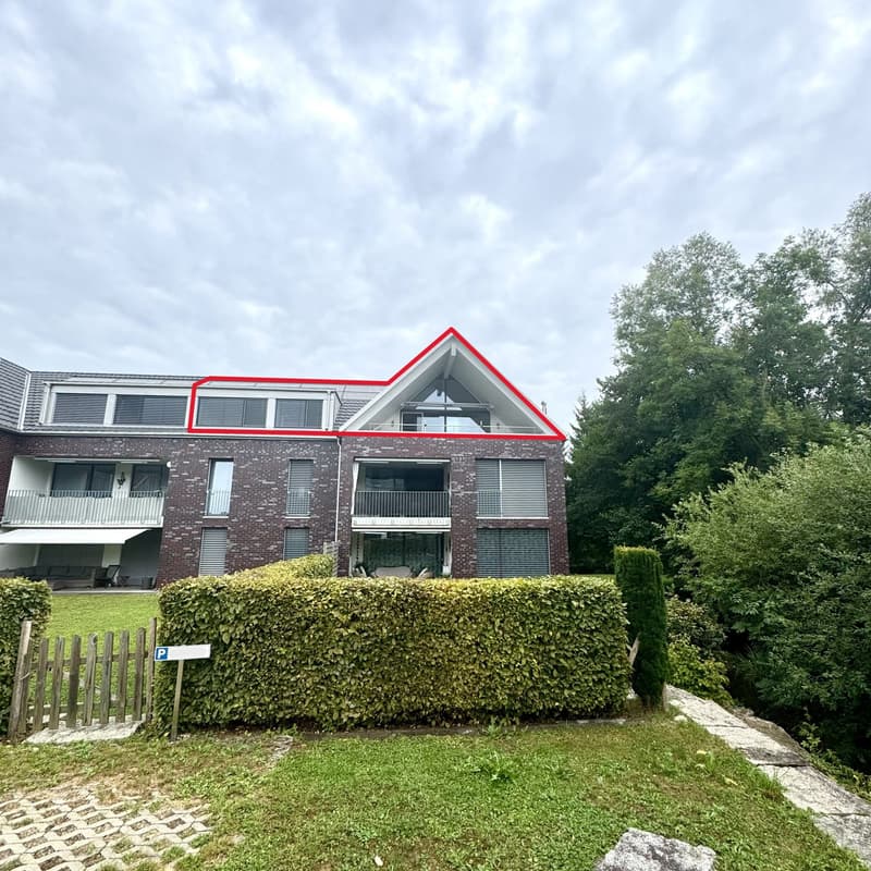 3 story house, red brick, white and gray windows, terrace on 3rd floor, balcony on 2nd floor, garden, shrubs, trees, parking sign in front of entrance