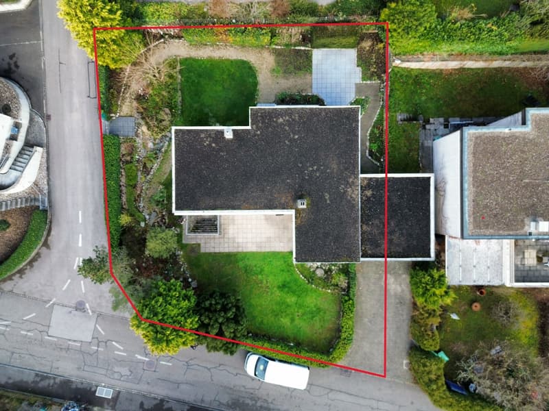 modern house, two levels, flat roof, car parked in front, landscaped yard