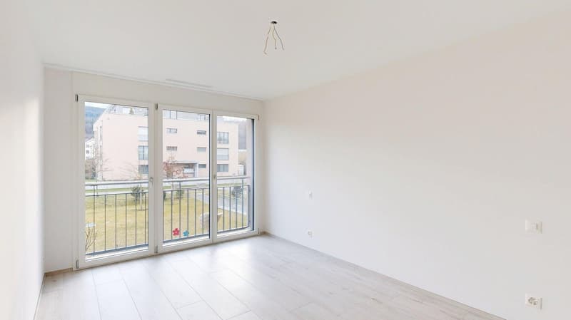 empty room, white walls, wooden floor, sliding glass doors, balcony