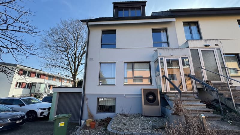 2 story house, white exterior, multiple windows, garage, stairs, air conditioning unit