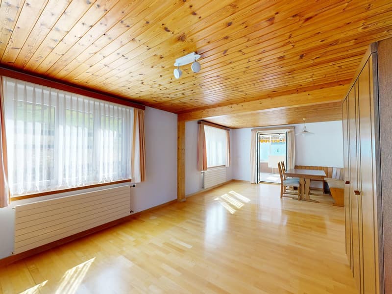 empty room, wooden floor, wooden ceiling, white walls, large windows, radiators, wooden table and chairs, sliding glass door