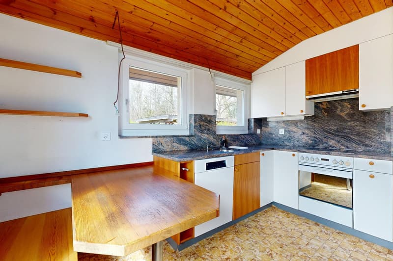 kitchen with wooden ceiling, white cabinets, granite countertops, wooden table, dishwasher