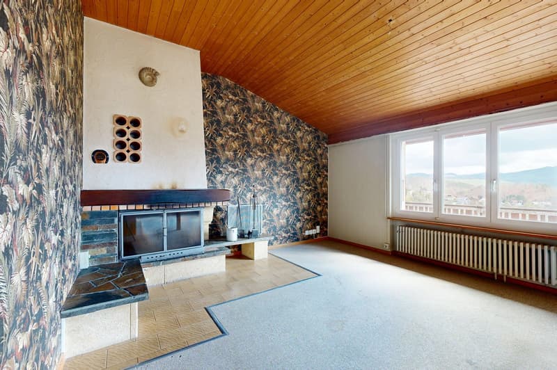 Fireplace, carpeted floor, radiator, large windows, wooden ceiling