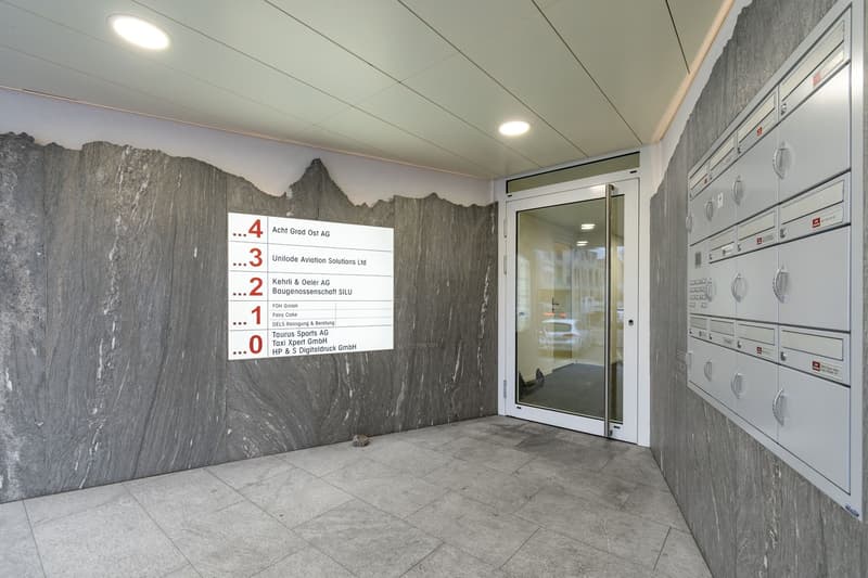 gray floor, white ceiling, mountain theme wall, glass door, mailbox
