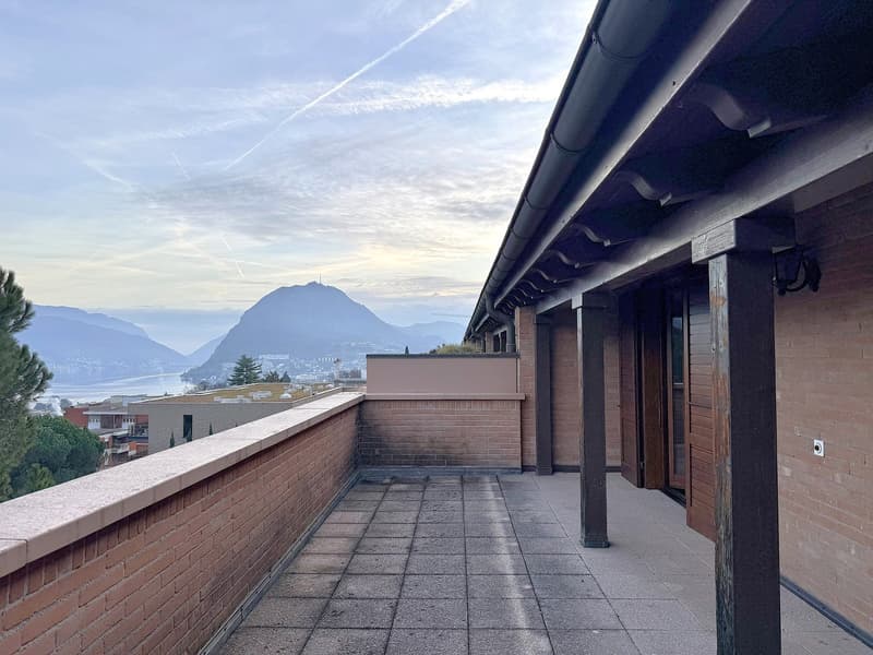 brick wall, tiled floor, mountains, water view