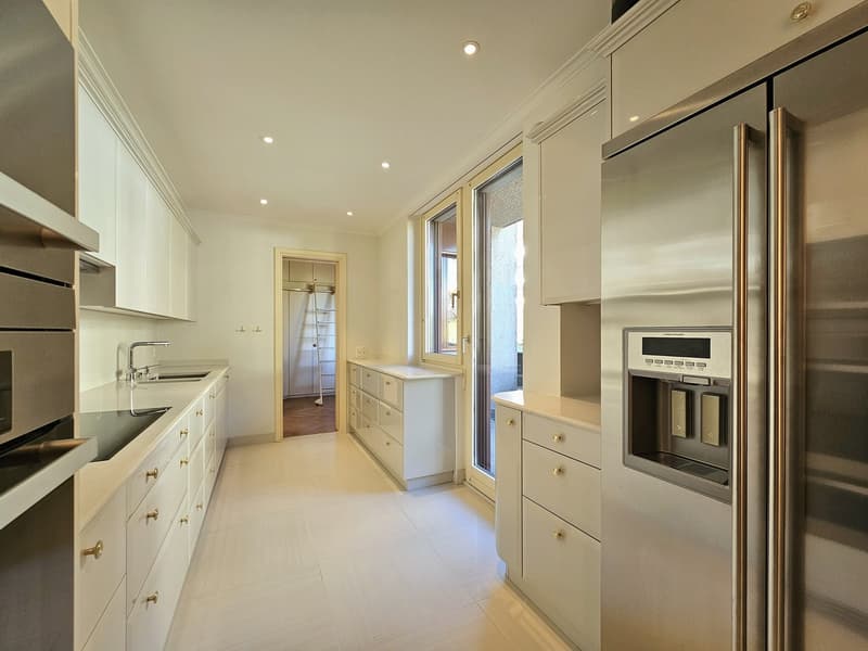 modern kitchen, white cabinets, stainless steel appliances, sink, refrigerator with ice maker, dishwasher, extractor hood, tiled floor