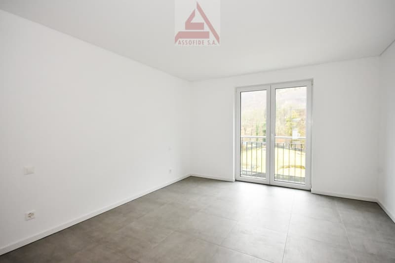 white walls, tile flooring, sliding glass doors, balcony