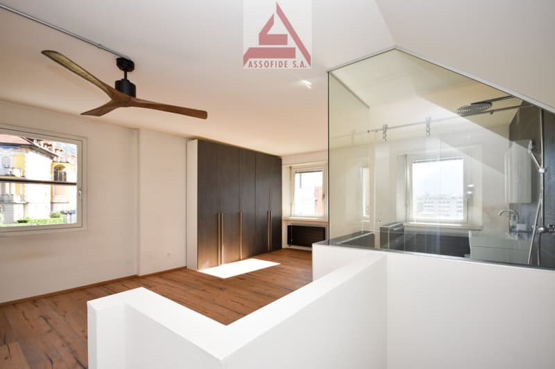empty room, wooden floors, windows, modern design, glass wall, shower enclosure