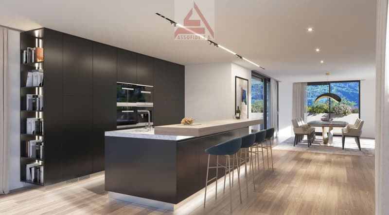 Modern kitchen with black cabinetry, white countertop, stainless steel faucet, large windows with outdoor view