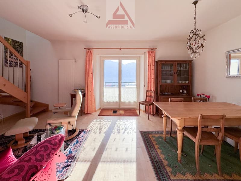 wooden dining table, wooden chairs, rug, cabinet, chair, staircase, lamps