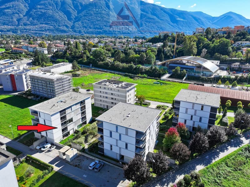 Multiple residential buildings with parking spaces
