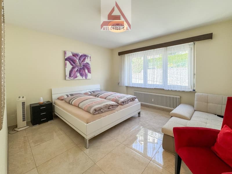 Double bed, nightstand, chest of drawers, picture frame, heater, couch, armchair, radiator
