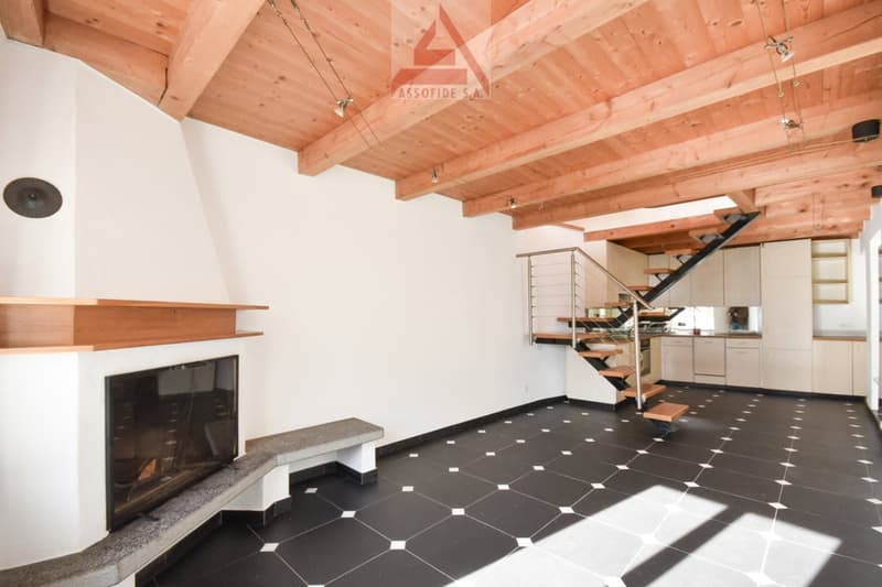 fireplace with mantle, modern design, large modern staircase, white walls, black floor