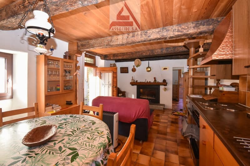 wooden ceiling, fireplace, dining table, wooden chair, cupboard