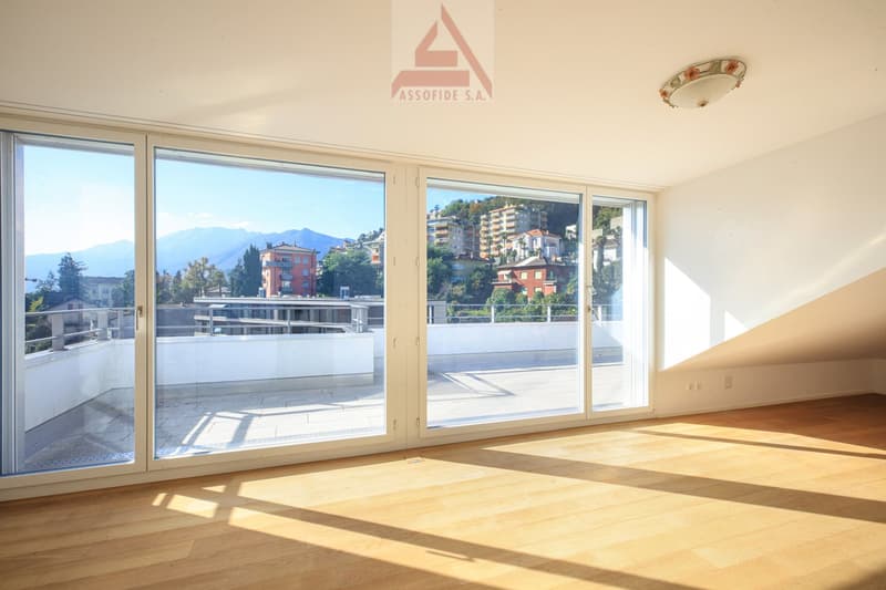 large sliding glass doors, wooden floor, balcony, mountain view