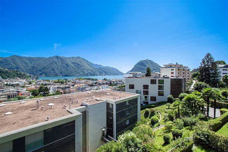 Appartamento in ottima posizione con fantastica vista panoramica sul lago / Wohnung mit herrlicher Panorama Seesicht an top Lage (2)