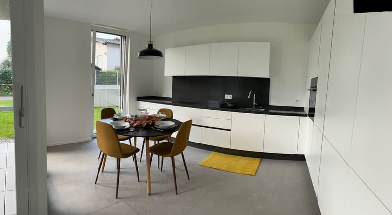dining area with white and black countertops, modern kitchen with yellow rug, modern chairs